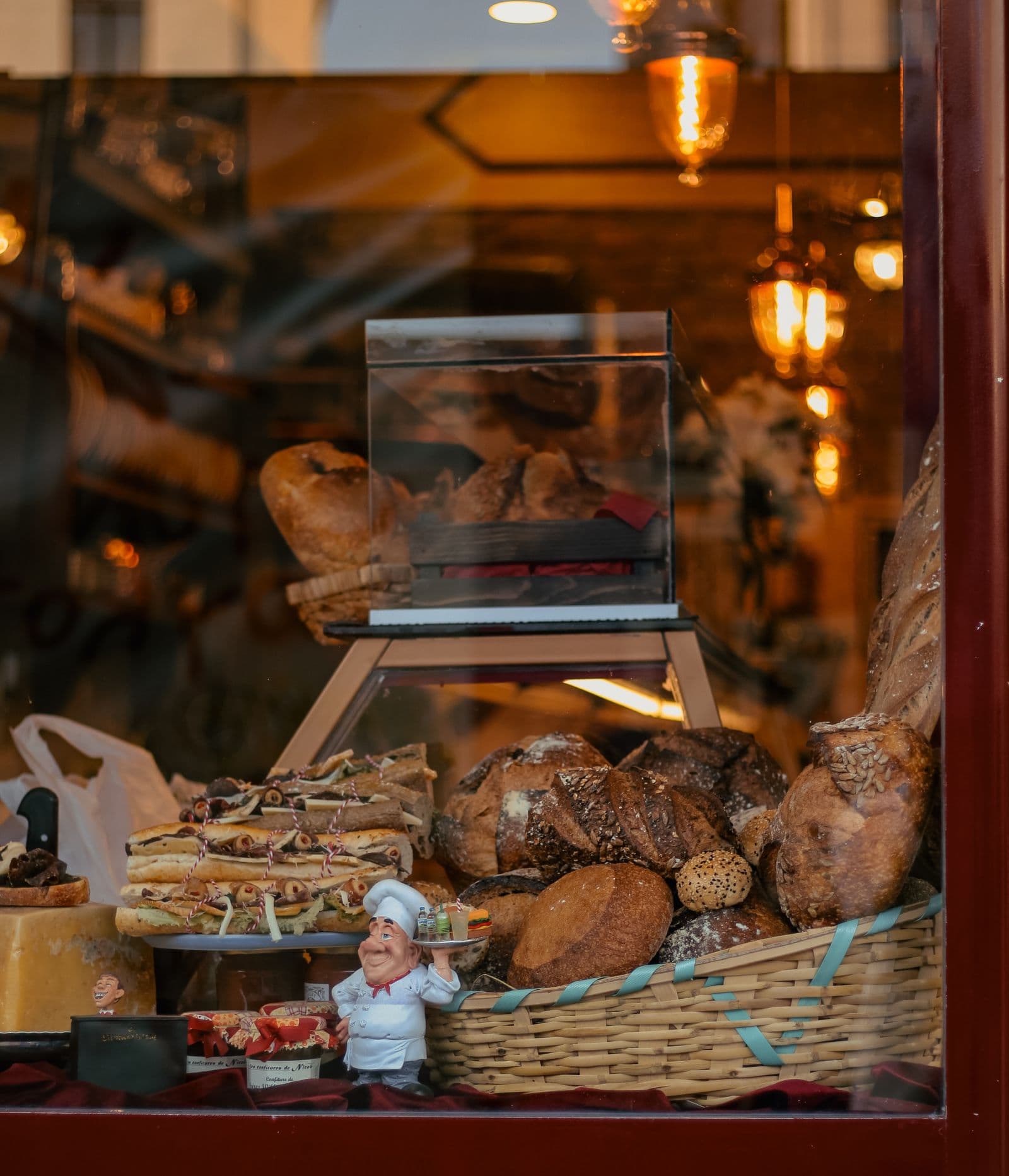 A bakery window filled with fresh breads and pastries