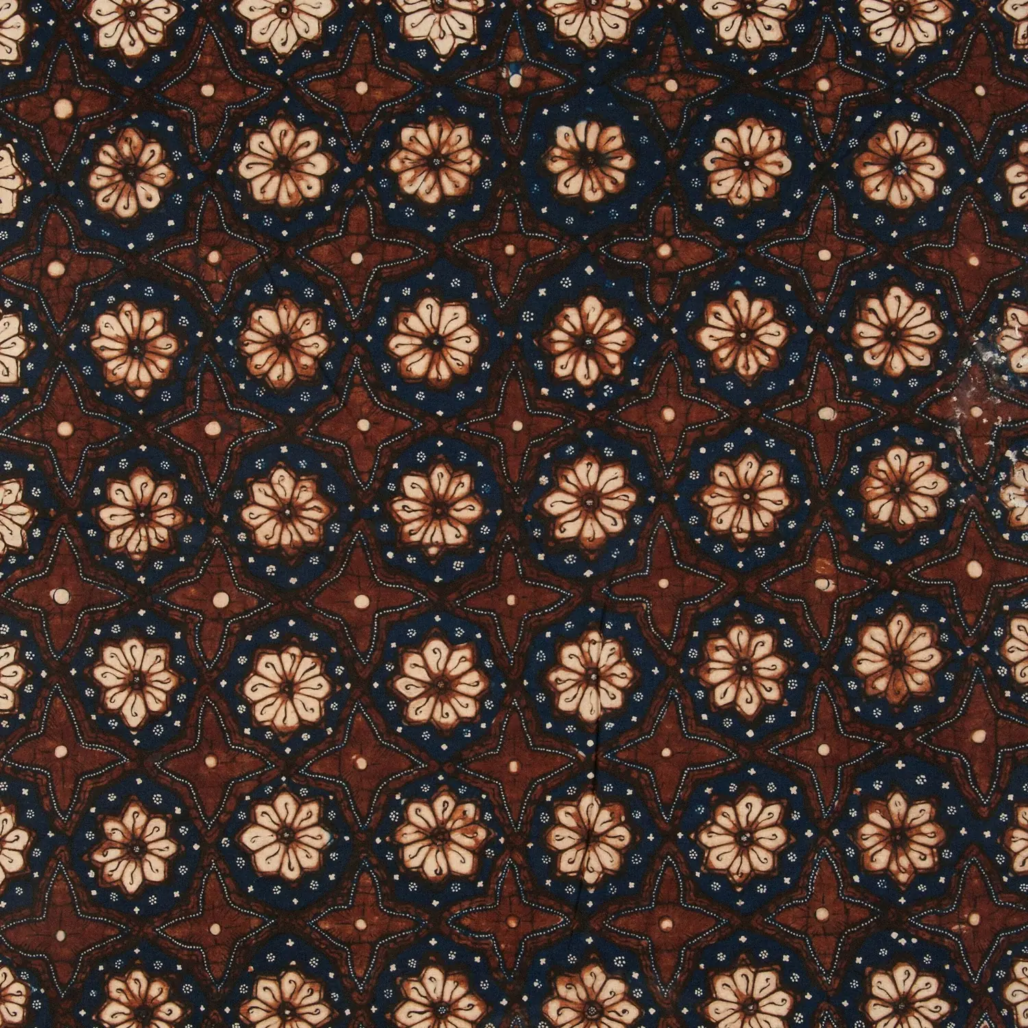 Batik with a repeating star and flower pattern