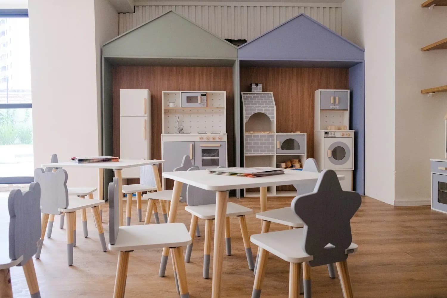 A play kitchen corner with child-size cooking toys
